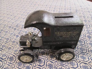 Ertl die cast replica Bank 1905 Fords first delivery car with The Holt Mfg Co advertisement