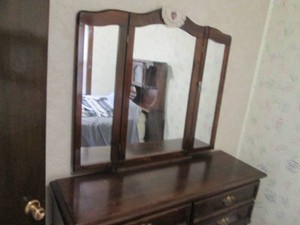 Vintage dark wood 6-drawer dresser with matching arched tri-fold mirror and brass tone ornate hardware approx 57x18x72in
