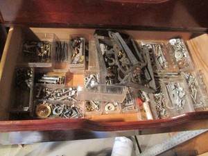 Variety of drill bits, assorted hardware and shelving brackets