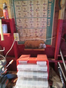 Plano Stow-a-way organizer with content, misc router bits and router bit guide poster