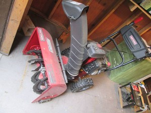 Well maintained newer style Craftsman gas powered 2-stage snowblower with 6-forward and 2-reverse gears, new tires, 24in clearing path, separate hand controls and chute adjustment