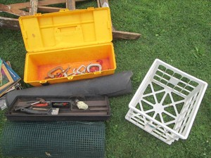 Long plastic tool box with lift out tray, misc hand tools, c-clamps, plastic milk crate, wire garden fencing and anti-fatigue matting