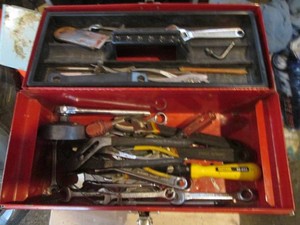 Red Metal toolbox with lift out tray, various style wrenches, misc hand tools and more