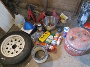 Automotive detailing supplies, jack stands, metal gas can, funnels, spare trailer tires and more