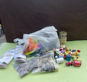 CRAFTING FEATHERS AND SPOOLS OF THREAD