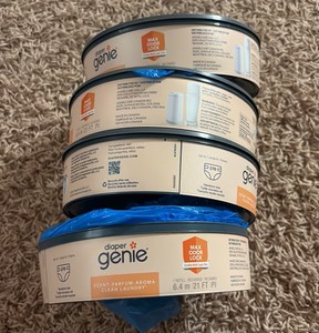 Diaper Genie Refill Canisters, 4-Refill Canisters Each One Can Hold 270 Diapers, One Canister is Slightly Used With a few Missinf, The Rest Are Unopened