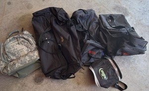 Lot of duffel bags and backpacks