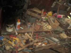 Antique hand tools, c-clamps, pipe clamps, content on workbench, in drawers and on wall as shown
