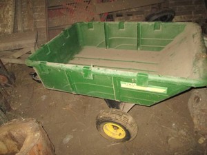 John Deere pull behind poly dump bucket wagon may need new tires