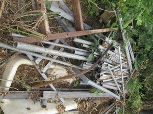 Pile of metal conduit in assorted sizes and lengths