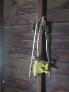 Pair of metal horseshoes and a garden sprinkler