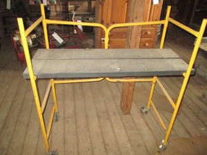 Tubular metal framed Fold-up rolling scaffolding unit