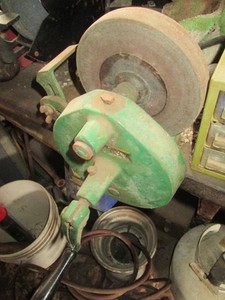 Antique manually operated bench grinder