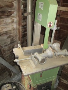 Freestanding meat saw grinder with attachments shown