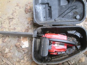 Homelite Textron gas chainsaw with hardside case