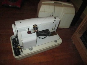 Vintage Hilton dressmaker sewing machine with top handle carrying case