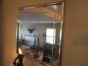 Brass tone framed Wall mirror approx 25in square