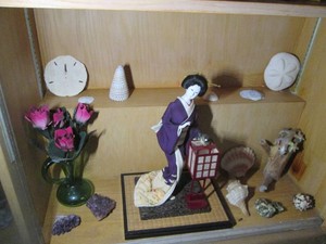 Japanese porcelain doll figure, sand dollars, sea shells, Brazilian amethysts and other decor