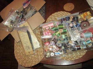Huge array of assorted color sewing threads, fastener buttons and other sewing notions