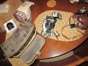 Vintage Canon AE-1 35mm camera with zoom lens and protective case, Zeiss Ikon Contaflex 35mm camera with case, Canon 2.8 macro wide angle Lens plus misc in leather multi-compartment travel bag
