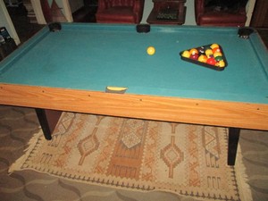 Laminate Entertainment size pool table with balls, rack and 1-cue stick