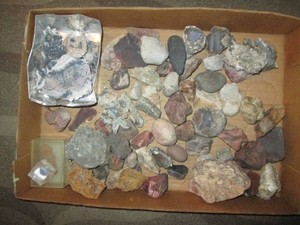Flat of cut rocks, lapis, geodes, crystals and other stones