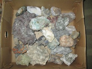 Shoebox containing Quartz, dominate, geodes, crystalsband other mineral rocks and stones