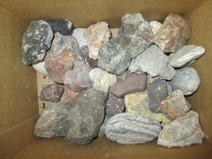 Box of granite rocks and other stones