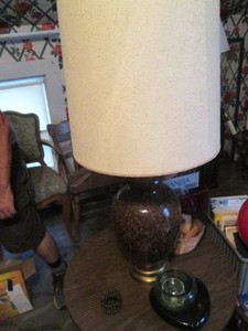 Vintage wood round end table, lamp, vintage glass ashtray and other misc shown in pics