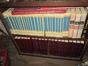 Vintage wood bookshelf with Vintage Encyclopedias, year books and other reading materials. shelf approx 36x15x30in