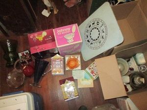 Vintage carnival glass dish, vintage glass case and pitchers, wood seasoning shakers, holiday tins, tempered glass cutting board, novelty toilet ice bucket and more