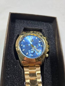 AJ Mens Gold-Tone Stainless Steel Watch  Blue Sunburst Chronograph-Style Dial  Date Display  10 BAR Water Resistant  New in Box