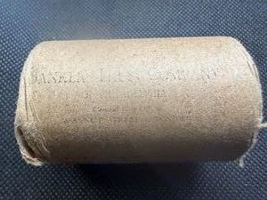 Unopened 20 coin roll of Morgan silver dollars with an 1891 at one end and a CC at the other end