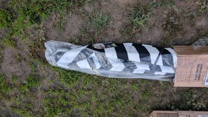 patio umbrella. new in box return black and white stripes