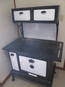 Antique cast iron wood burning stove oven