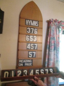 Vintage wood Church direction board sign with carved cross detail includes numbers and letters