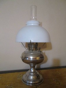 Vintage metal oil lamp with hurricane center glass and milk glass style shade