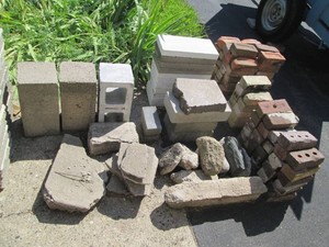 Cement and brick pavers, rocks and assorted landscaping stones