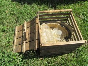 Antique wood crate style egg carrier with canning jar and misc