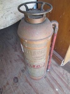 Antique metal fire extinguisher