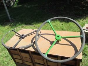 Pair of vintage metal tractor steering wheels