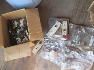 Variety of Antique metal door hardware and cabinet hinges