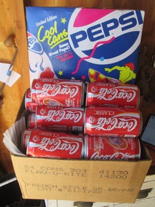 Vintage Coca-Cola and Pepsi collectible cans