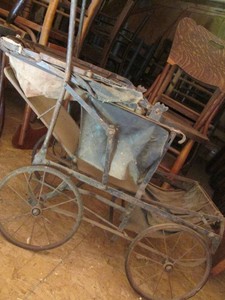 Antique metal framed baby buggy stroller