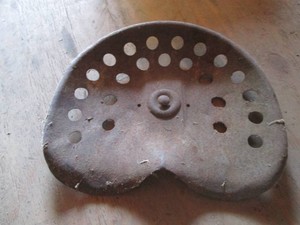 Vintage metal tractor seat
