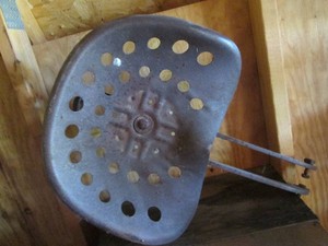 Vintage metal tractor seat with frame