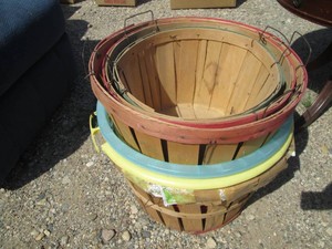 Wood bushel baskets and plastic baskets