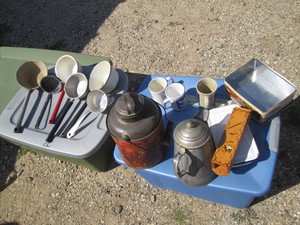 Vintage metal and enamelware ladles, pitcher and bakeware, advertisement mugs and tin plus wood matchbox holder