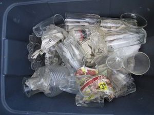 Vintage glass highball, shot glasses and other glassware in covered tote