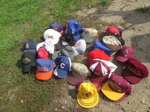 Variety of state themed baseball hats, snap backs and other hats